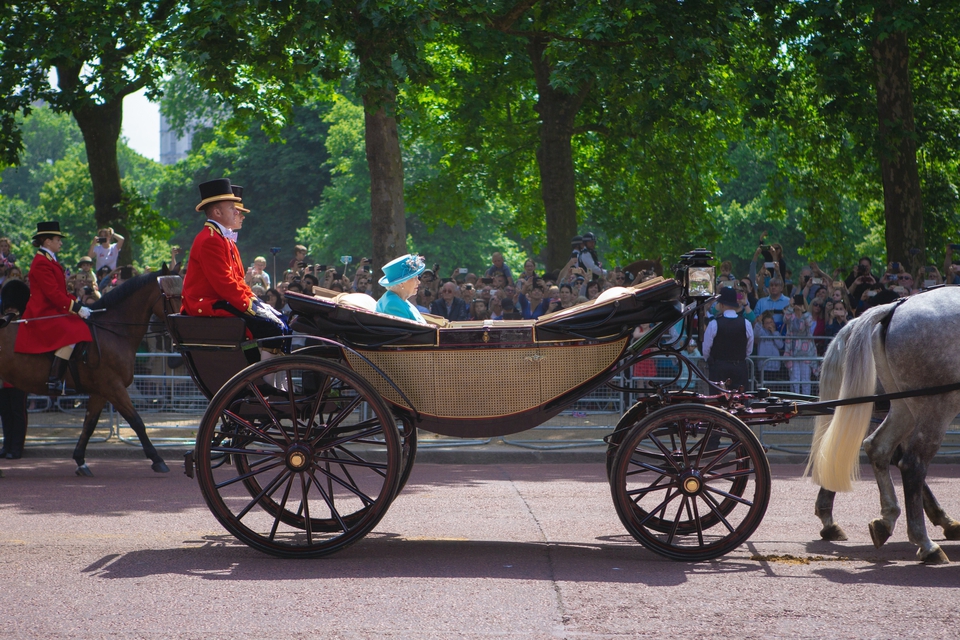 Her Majesty the Queen in a horse drawn carriage 