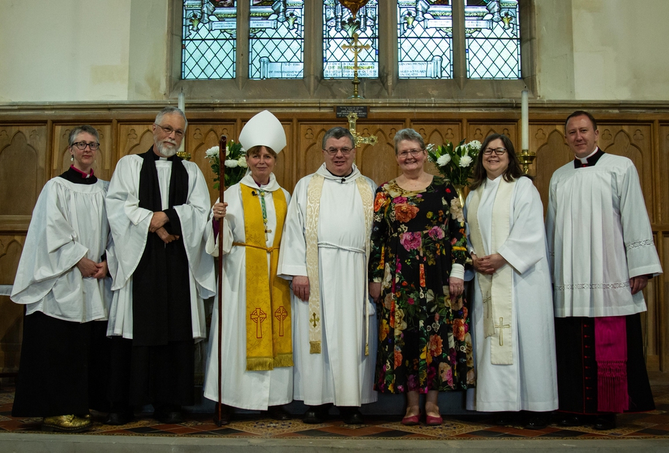 The Revd Gareth Lloyd, his wife Liz and the clergy who attended his licensing service