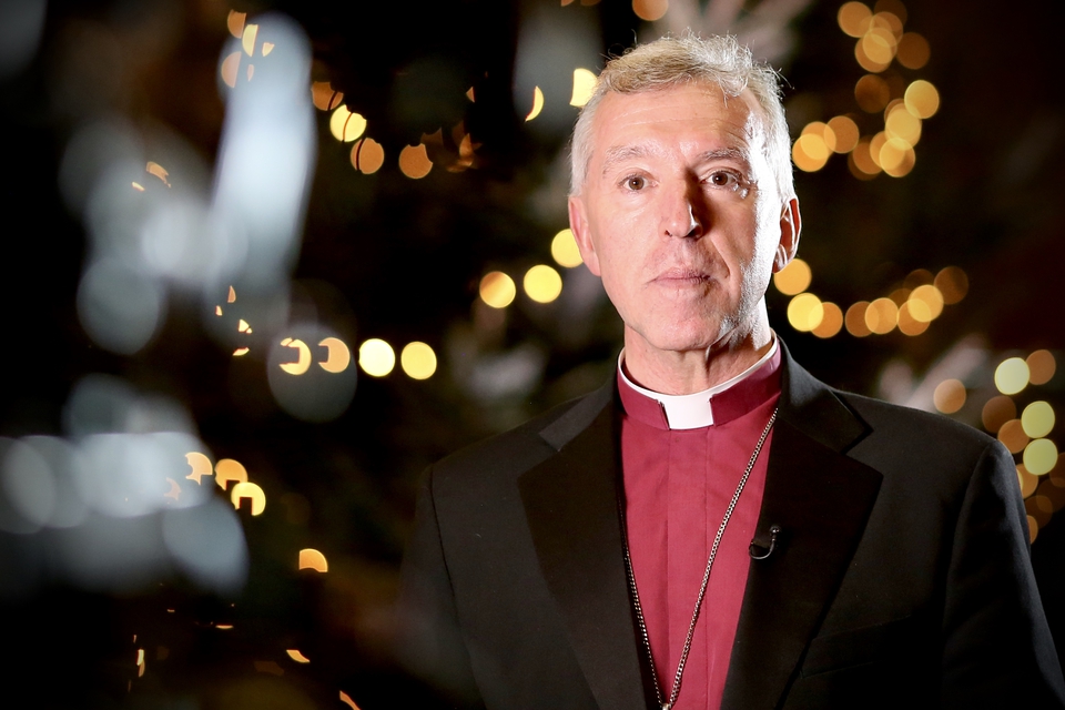 The Archbishop in front of a Christmas tree